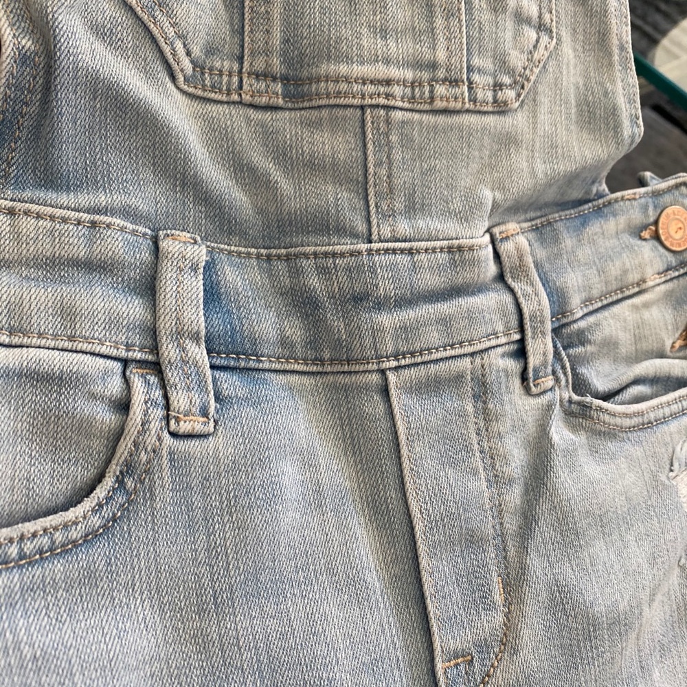 Overall denim light blue ripped jeans